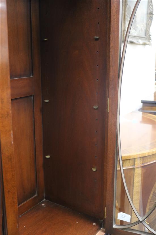 A George III style mahogany domed top bookcase W.112cm